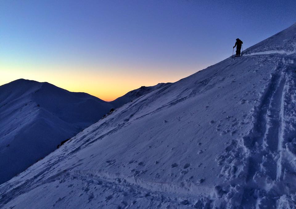 Backcountry skiing in Alaskan sunset